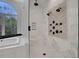 Luxurious bathroom showcasing a glass-enclosed shower, soaking tub, and elegant fixtures at 821 Camden Park Ct, Atlanta, GA 30342