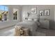 Cozy bedroom with gray walls, two windows, and cheerful decorations at 821 Camden Park Ct, Atlanta, GA 30342
