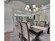 Beautiful dining room with a modern chandelier, wood table, and views to other rooms at 821 Camden Park Ct, Atlanta, GA 30342