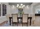 Elegant dining room with modern lighting, neutral colors, and stylish decor at 821 Camden Park Ct, Atlanta, GA 30342