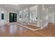 Spacious foyer with hardwood floors, decorative columns, and recessed lighting at 821 Camden Park Ct, Atlanta, GA 30342
