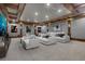 Home theater featuring tiered seating, wooden trim, and a large screen for entertainment at 821 Camden Park Ct, Atlanta, GA 30342
