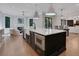 Modern kitchen with a center island, stainless steel appliances, and an open view to the living area at 821 Camden Park Ct, Atlanta, GA 30342
