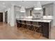 Modern kitchen with stainless steel appliances, gray cabinets, and an island with barstool seating at 821 Camden Park Ct, Atlanta, GA 30342