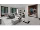 Spacious living room with modern furnishings, sleek decor, and a pool table in the background at 821 Camden Park Ct, Atlanta, GA 30342