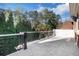 Large stone patio with decorative railing offering scenic views of the surrounding landscape at 821 Camden Park Ct, Atlanta, GA 30342