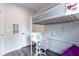 A bedroom showcasing a lofted bed with desk space underneath and decorative elements at 135 Climbing Ivy Cir, Fayetteville, GA 30214