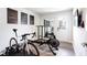 Bright home gym featuring motivational art, wood-look floors, mirrors, and exercise equipment at 135 Climbing Ivy Cir, Fayetteville, GA 30214