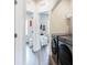 A narrow laundry room featuring a new washer and dryer at 135 Climbing Ivy Cir, Fayetteville, GA 30214