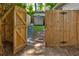 Backyard featuring a wooden fence, pathway, and shed, offering a private and functional outdoor space at 135 Martha Ne Ave, Atlanta, GA 30317
