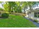Backyard features a well-maintained lawn, wooden fence, and a view of the rear of the house at 135 Martha Ne Ave, Atlanta, GA 30317