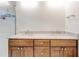 Bathroom features a double vanity with marble countertop and wood cabinets, next to a tiled shower with glass door at 135 Martha Ne Ave, Atlanta, GA 30317