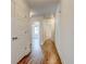 Bright hallway features hardwood flooring, white trim, and access to multiple rooms at 135 Martha Ne Ave, Atlanta, GA 30317