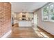 Open concept kitchen featuring stainless steel appliances, granite counters, and hardwood floors at 135 Martha Ne Ave, Atlanta, GA 30317