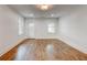 Bright living room with hardwood floors, white walls, and modern lighting at 135 Martha Ne Ave, Atlanta, GA 30317
