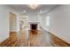 Spacious living room with hardwood floors, fireplace, and view into the kitchen at 135 Martha Ne Ave, Atlanta, GA 30317