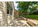 Outdoor patio with stylish block wall and stone features with direct access to the backyard at 135 Martha Ne Ave, Atlanta, GA 30317