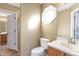 Bright bathroom features a vanity, toilet, and framed window for natural light at 320 Harden St, Atlanta, GA 30312
