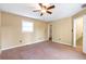 Large bedroom features neutral tones and carpeting, with a large closet for storage at 320 Harden St, Atlanta, GA 30312