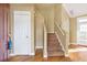 The home's entryway features hardwood floors, a staircase, and neutral wall color at 320 Harden St, Atlanta, GA 30312