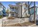 Charming two-story home features a welcoming front porch and a classic white picket fence at 320 Harden St, Atlanta, GA 30312