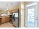 Kitchen features stainless steel refrigerator and convenient access to an outdoor patio at 320 Harden St, Atlanta, GA 30312