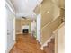 The home's living room features hardwood floors, a fireplace, staircase, and neutral wall color at 320 Harden St, Atlanta, GA 30312