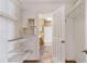 Walk-in closet with built-in shelving leads to the bathroom at 320 Harden St, Atlanta, GA 30312