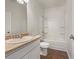 Standard bathroom featuring a vanity sink, toilet, and a shower-tub combination at 36 Crescent, Dallas, GA 30157