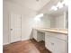 Bathroom featuring double vanity with white cabinets and hard surface countertops at 36 Crescent, Dallas, GA 30157