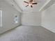 Spacious bedroom with tray ceilings, ceiling fan, and plush carpeting throughout at 36 Crescent, Dallas, GA 30157