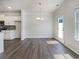Open dining room area adjacent to the kitchen, featuring a modern chandelier at 36 Crescent, Dallas, GA 30157