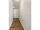 Hallway with hardwood floors leading to a white front door at 36 Crescent, Dallas, GA 30157
