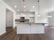Modern kitchen featuring granite countertops, a large island, and stainless steel appliances at 36 Crescent, Dallas, GA 30157