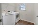 Functional laundry room with washer, dryer, and a wire shelf at 36 Crescent, Dallas, GA 30157