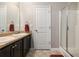 Bathroom featuring double sink, granite counters and tiled floor at 368 Rankin Cir, Mcdonough, GA 30253