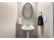 Powder room showcasing pedestal sink, neutral paint, and updated fixtures at 368 Rankin Cir, Mcdonough, GA 30253