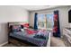 Themed bedroom with unique bedding and window to the outdoors at 368 Rankin Cir, Mcdonough, GA 30253