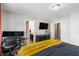 This bedroom features natural light, desk area, carpet and television at 368 Rankin Cir, Mcdonough, GA 30253