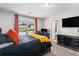 This bedroom features natural light, desk area, carpet and television at 368 Rankin Cir, Mcdonough, GA 30253