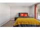 A charming bedroom with neutral walls, carpet and large window at 368 Rankin Cir, Mcdonough, GA 30253