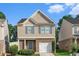 Charming two-story home with brick and siding facade, blue shutters, and well-maintained landscaping at 368 Rankin Cir, Mcdonough, GA 30253
