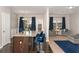 Open concept living space featuring a kitchen island, dining area, and comfortable seating, perfect for modern living at 368 Rankin Cir, Mcdonough, GA 30253