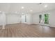 Finished basement with wood flooring, walk-out french doors, and neutral color walls at 3710 Country Estate Dr Nw, Kennesaw, GA 30152