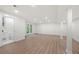 Spacious basement with wood flooring and door to outside, perfect for extra living space at 3710 Country Estate Dr Nw, Kennesaw, GA 30152