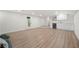 Open basement area with a wet bar, white cabinets and a door to the exterior at 3710 Country Estate Dr Nw, Kennesaw, GA 30152