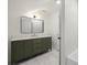 Stylish bathroom featuring a sleek vanity with marble countertop, and a modern mirror at 3710 Country Estate Dr Nw, Kennesaw, GA 30152