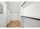 Walk-in closet featuring custom shelving and hardwood floors, offering ample storage space at 3710 Country Estate Dr Nw, Kennesaw, GA 30152