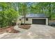 Inviting exterior with a two-car garage, walkway, and stairs leading to the front door at 3710 Country Estate Dr Nw, Kennesaw, GA 30152