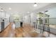 Bright, open kitchen featuring stainless steel appliances, white cabinets and hardwood floors at 3710 Country Estate Dr Nw, Kennesaw, GA 30152